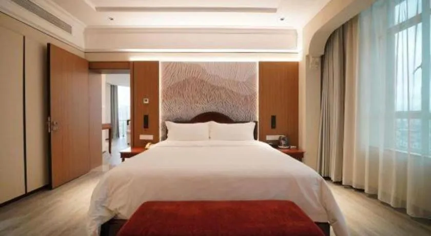 Bed in Hua Xia Pearl Hotel