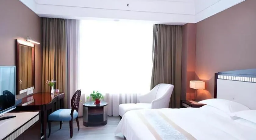 Bed in Hua Xia Pearl Hotel