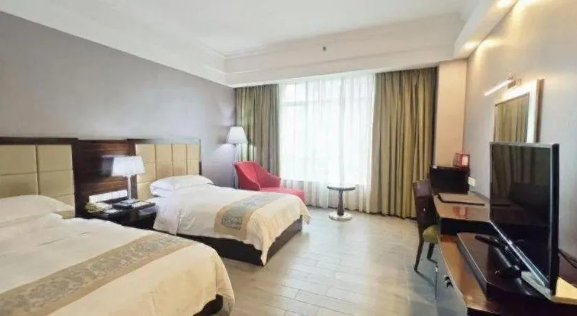 Bed in Hua Xia Pearl Hotel