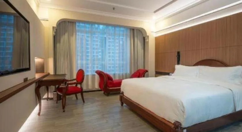 Bed in Hua Xia Pearl Hotel