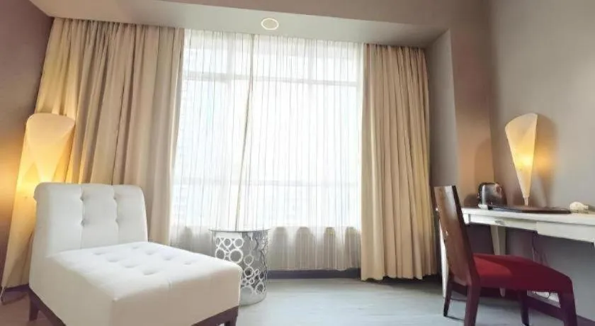 Bed in Hua Xia Pearl Hotel