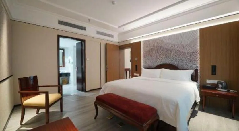 Bed in Hua Xia Pearl Hotel