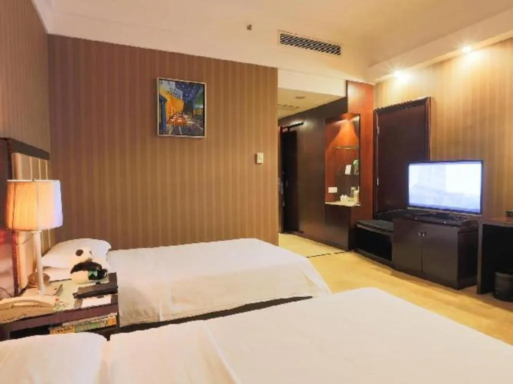 Bed in Hua Xia Pearl Hotel