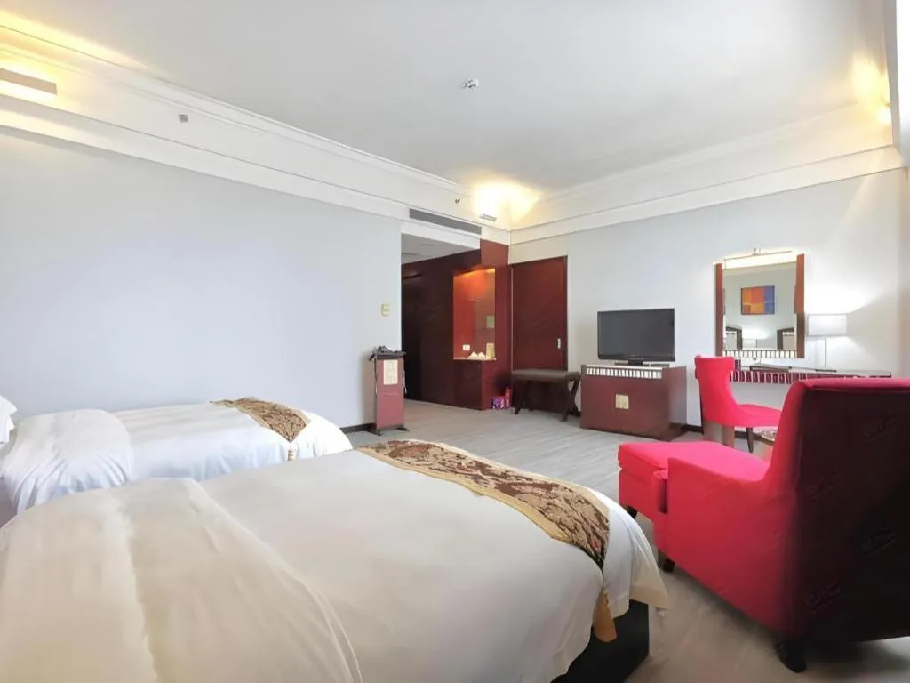 Bed in Hua Xia Pearl Hotel