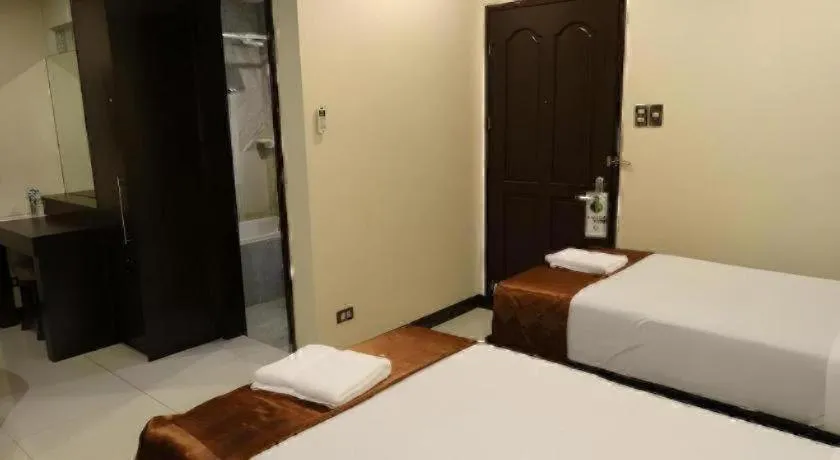 Bed in Peridot Suites