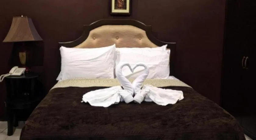 Bed in Peridot Suites