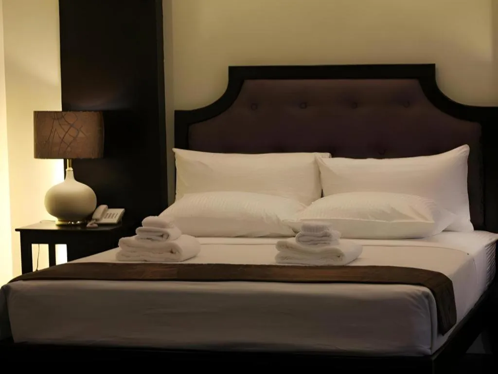 Bed in Peridot Suites