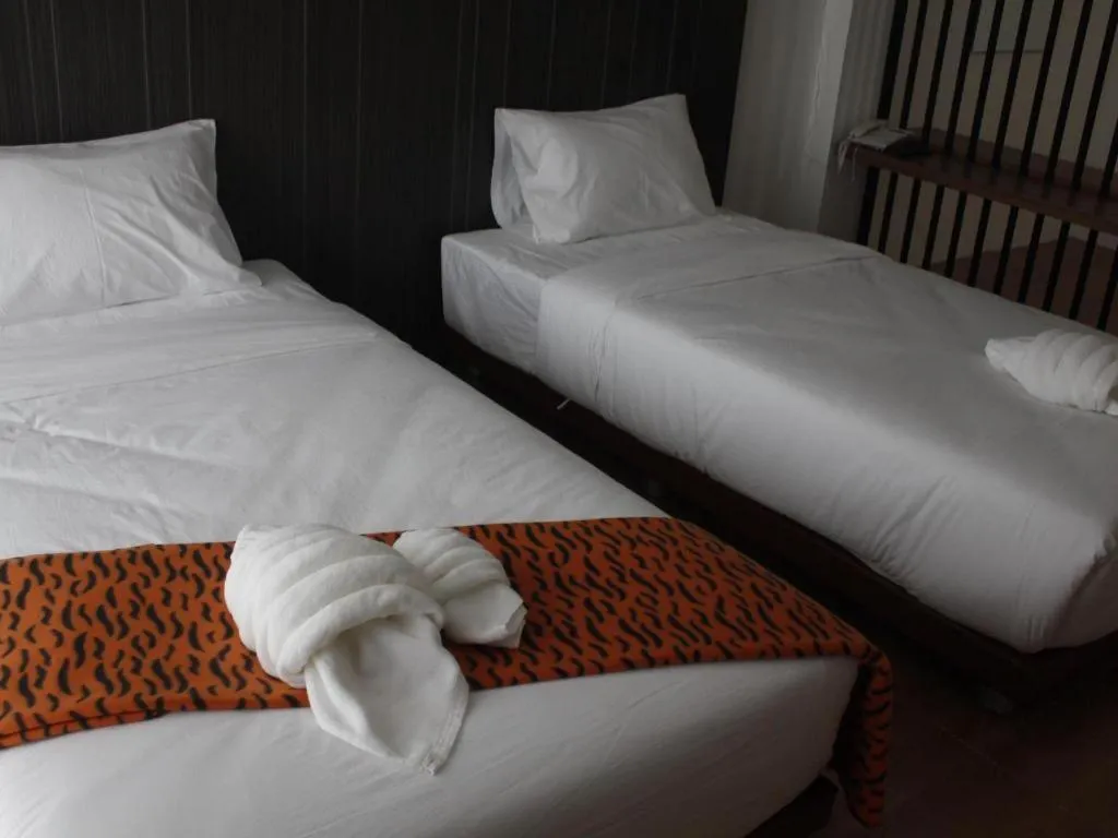 Bed in The Pride Hotel At Laemsing