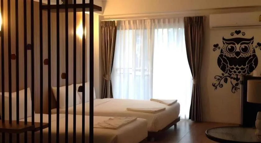 Bed in The Pride Hotel At Laemsing