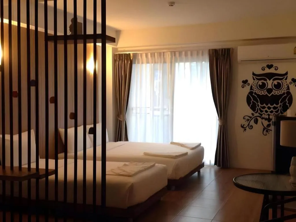 Bed in The Pride Hotel At Laemsing