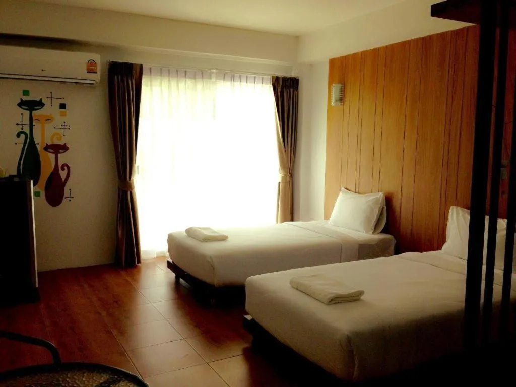 Bed in The Pride Hotel At Laemsing