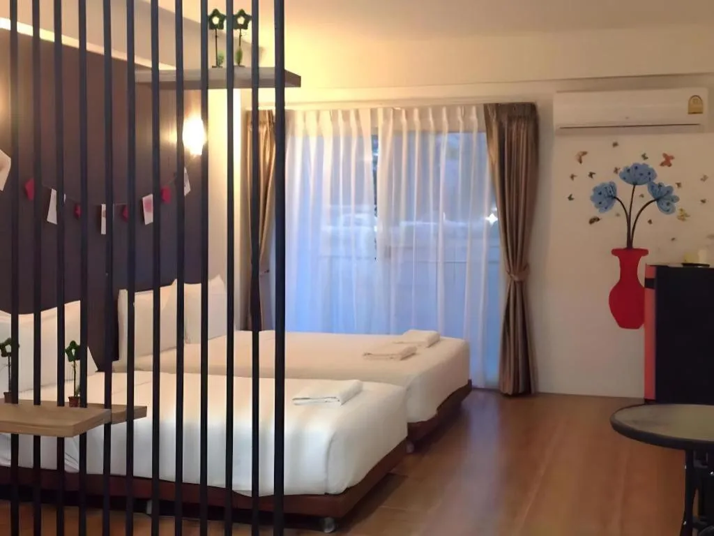 Bed in The Pride Hotel At Laemsing