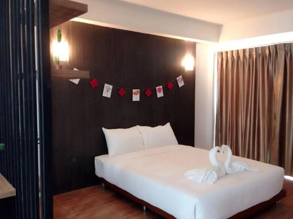 Bed in The Pride Hotel At Laemsing