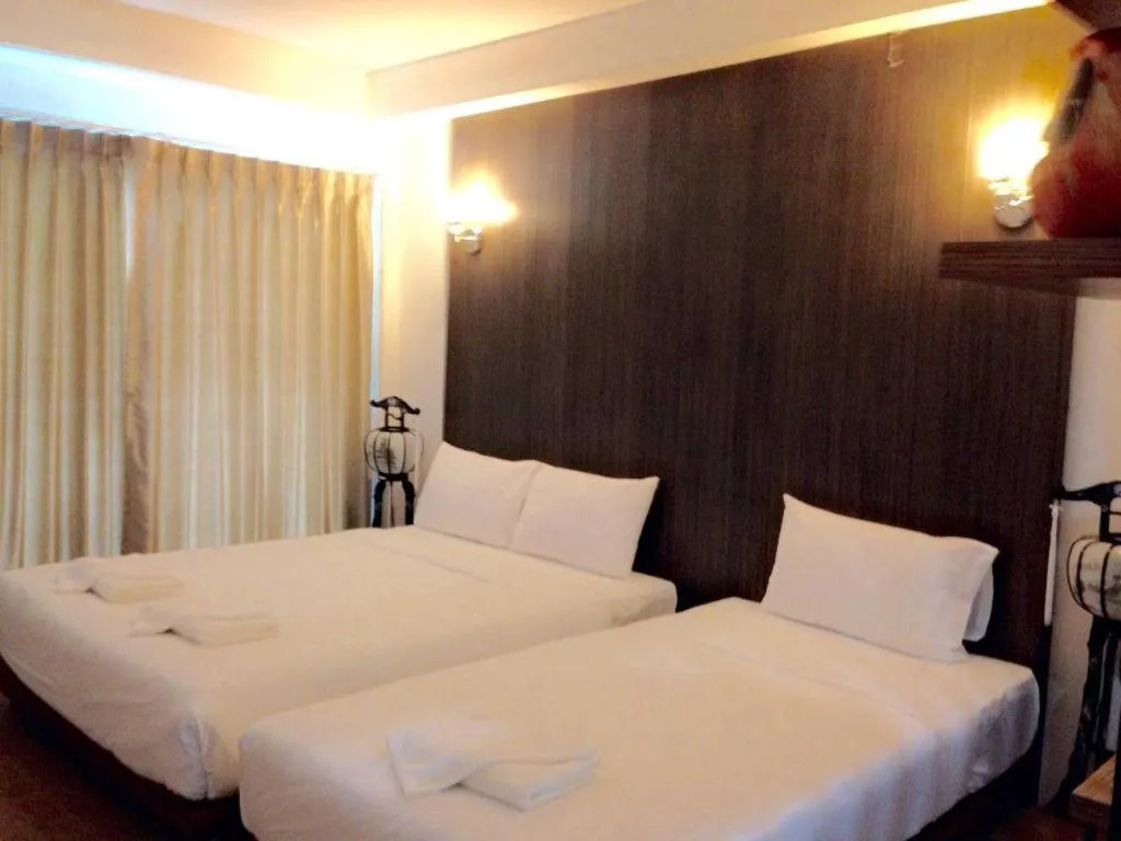 Bed in The Pride Hotel At Laemsing