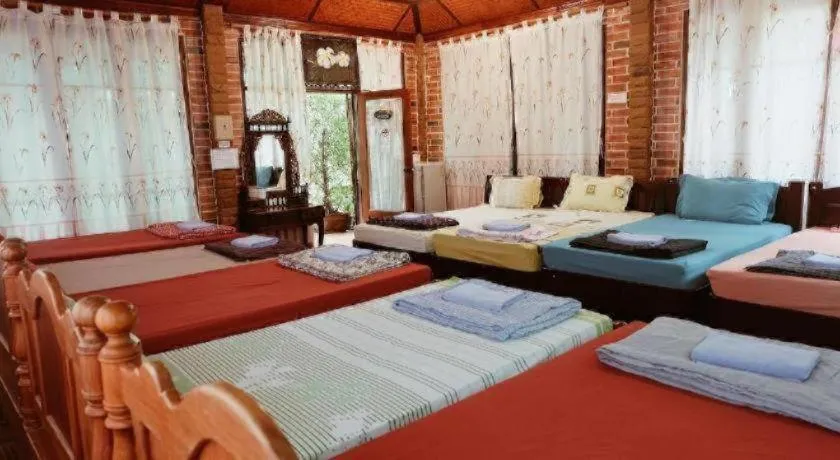 Bed in RuenNamyen Resort Amphawa