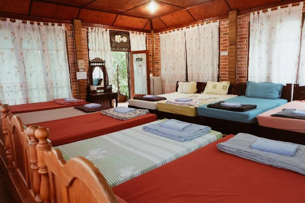 Bed in RuenNamyen Resort Amphawa