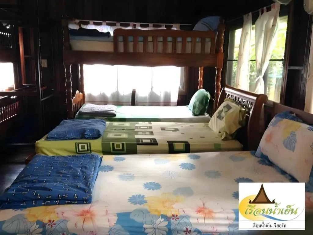 Bed in RuenNamyen Resort Amphawa