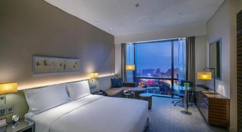 Bed in New World Guiyang Hotel