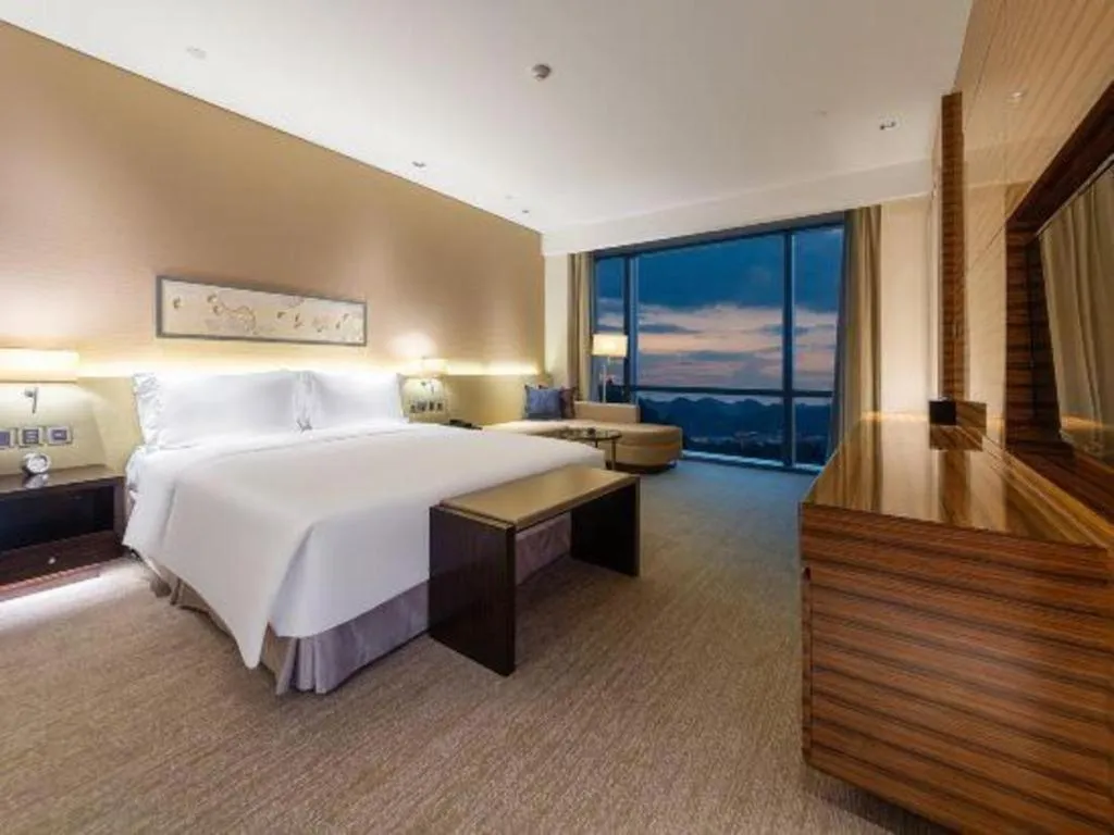 Bed in New World Guiyang Hotel