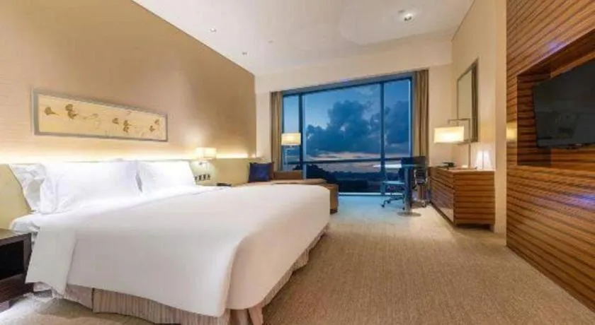 Bed in New World Guiyang Hotel