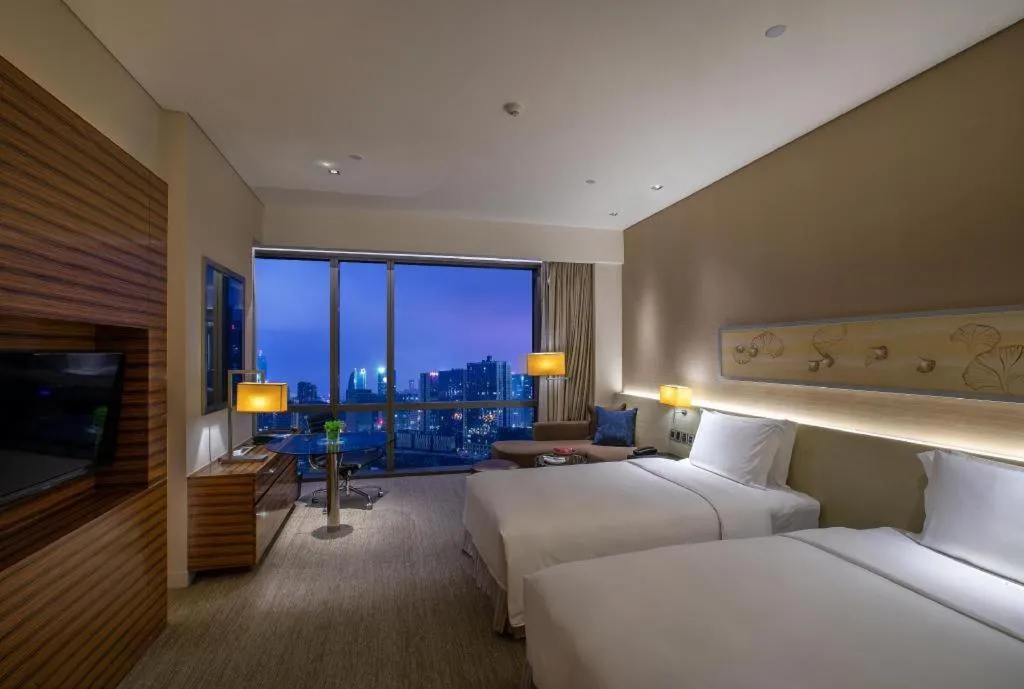 Bed in New World Guiyang Hotel