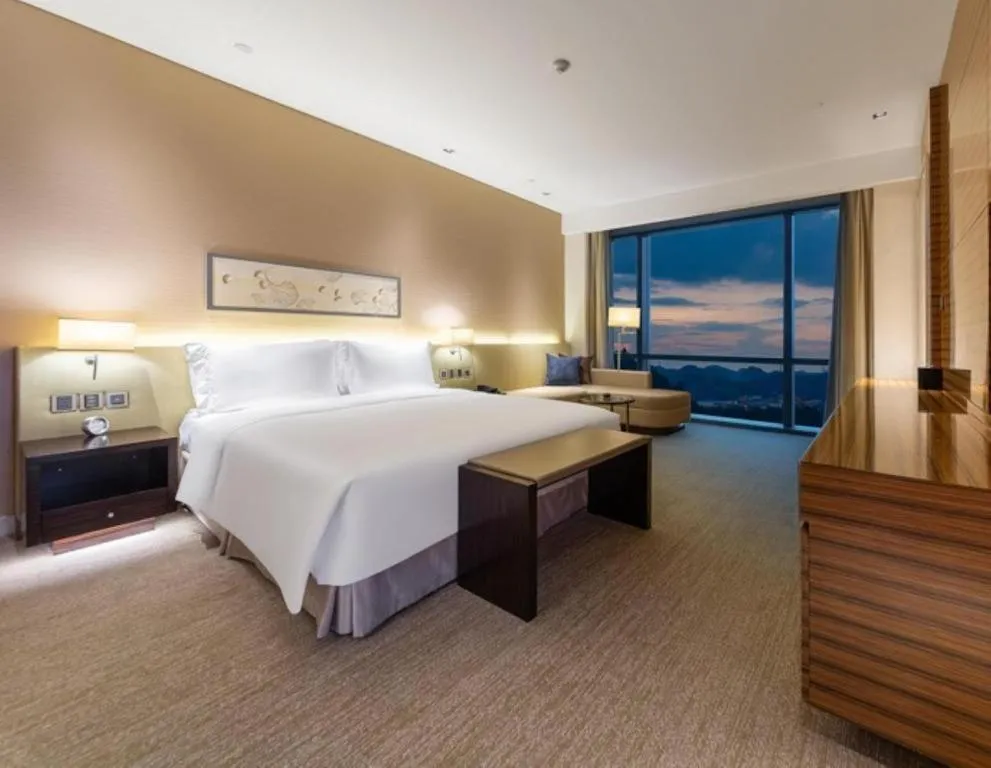 Bed in New World Guiyang Hotel