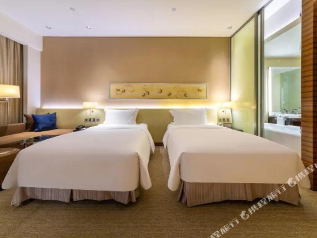 Bed in New World Guiyang Hotel