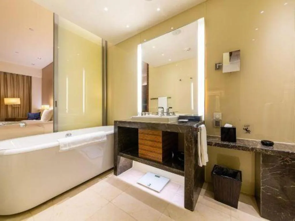 Bed in New World Guiyang Hotel