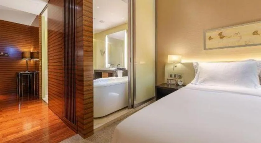 Bed in New World Guiyang Hotel
