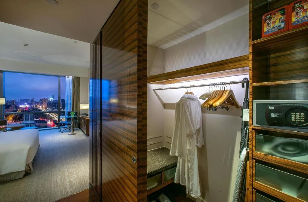 Bed in New World Guiyang Hotel