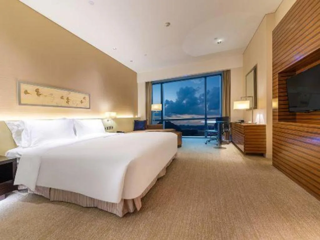 Bed in New World Guiyang Hotel