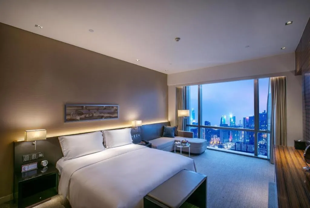 Bed in New World Guiyang Hotel