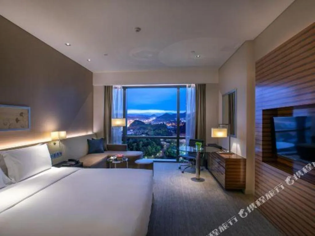 Bed in New World Guiyang Hotel