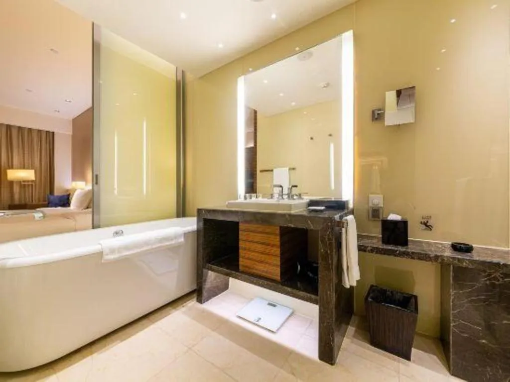 Bed in New World Guiyang Hotel