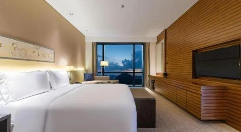 Bed in New World Guiyang Hotel