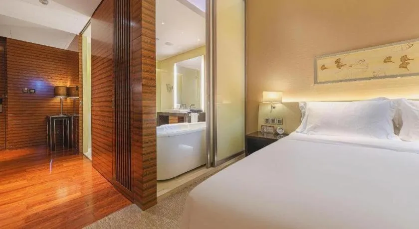 Bed in New World Guiyang Hotel