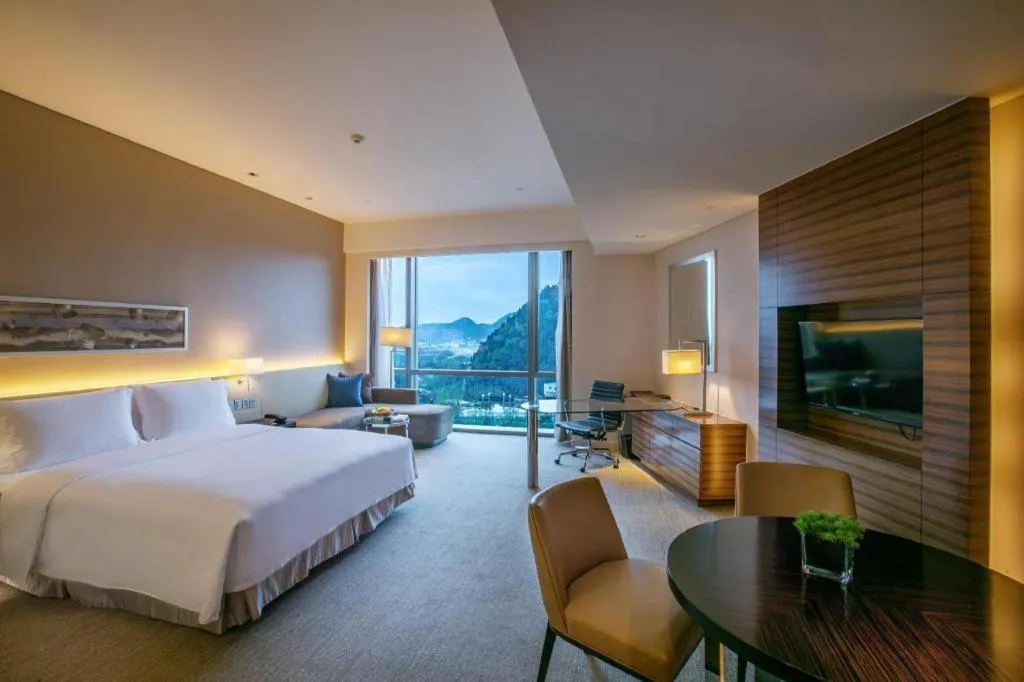 Bed in New World Guiyang Hotel