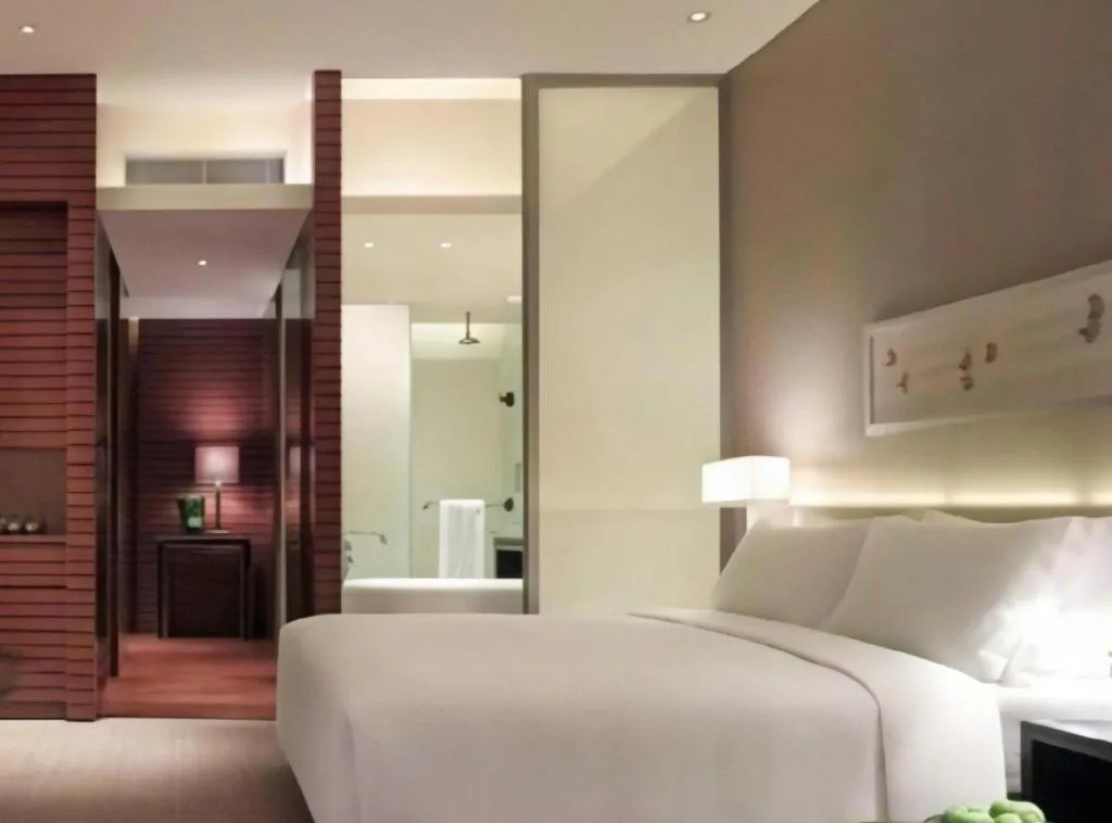 Bed in New World Guiyang Hotel