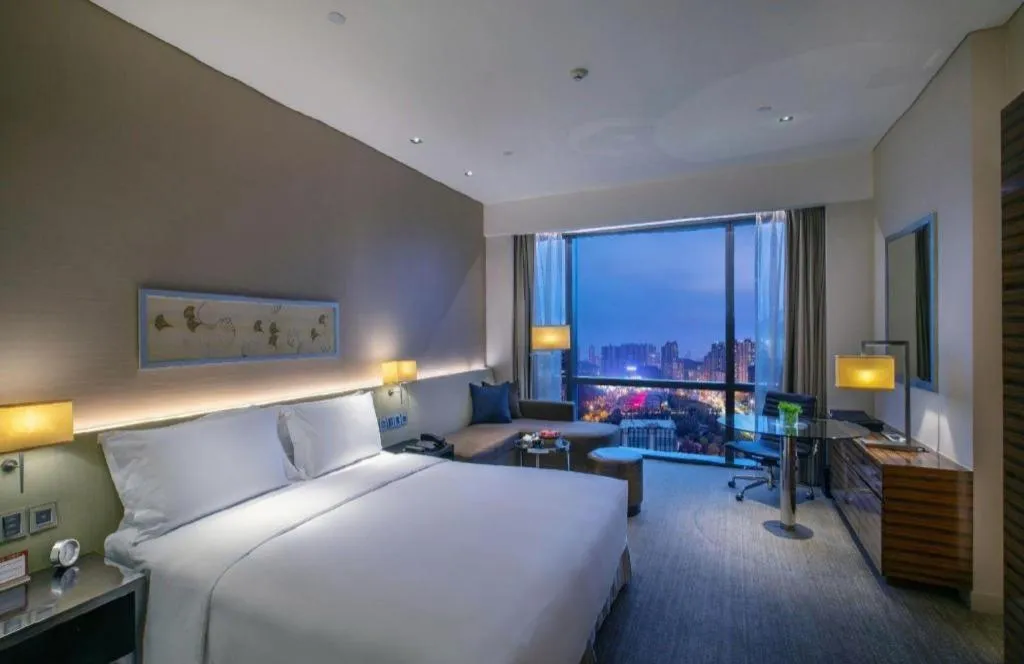 Bed in New World Guiyang Hotel