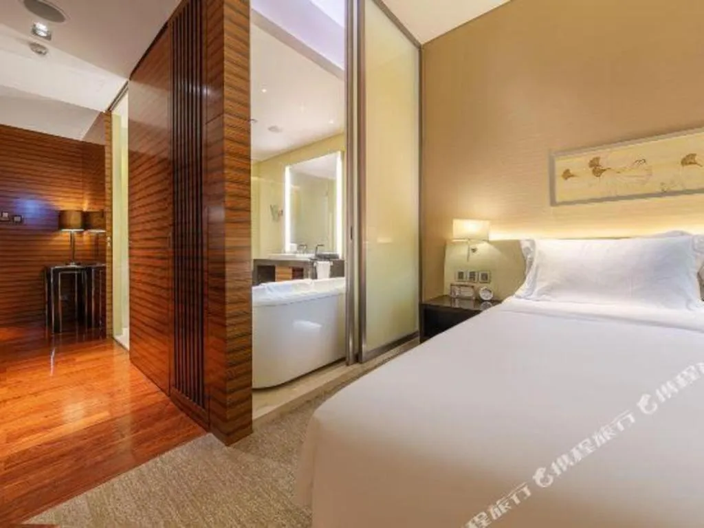 Bed in New World Guiyang Hotel