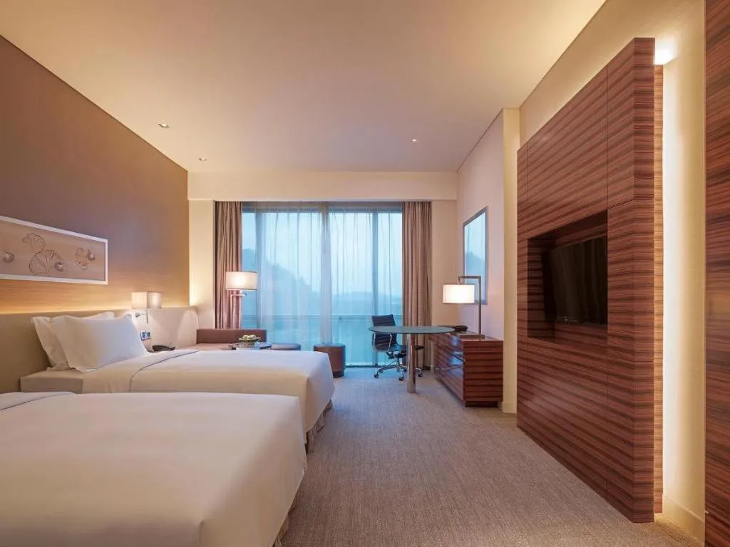 Bed in New World Guiyang Hotel