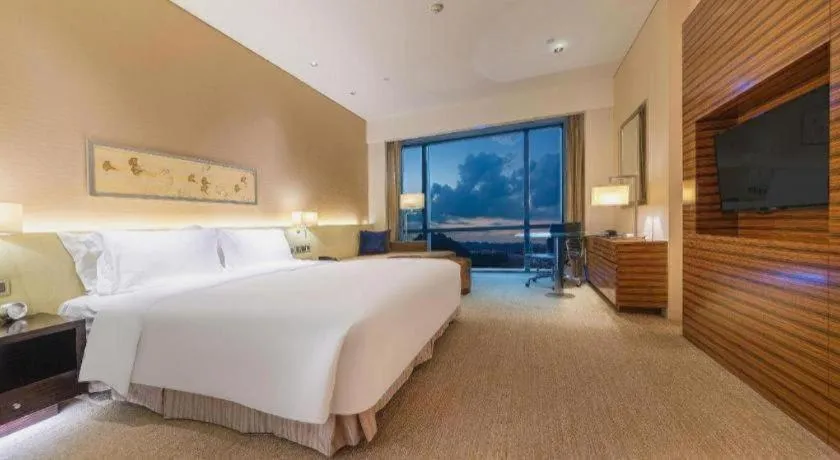 Bed in New World Guiyang Hotel