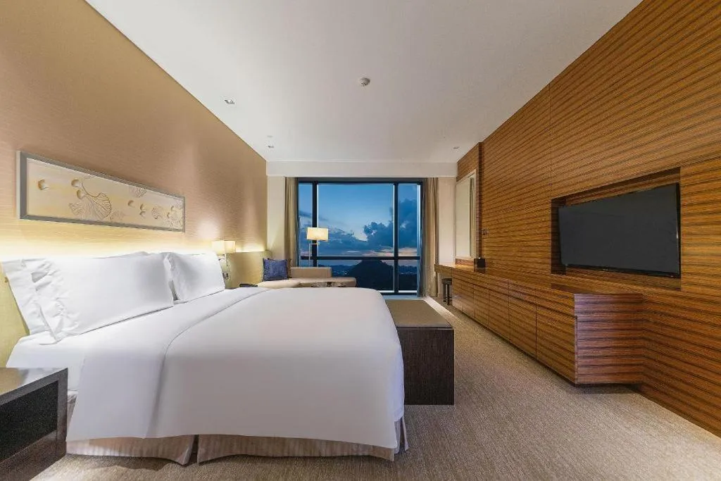 Bed in New World Guiyang Hotel