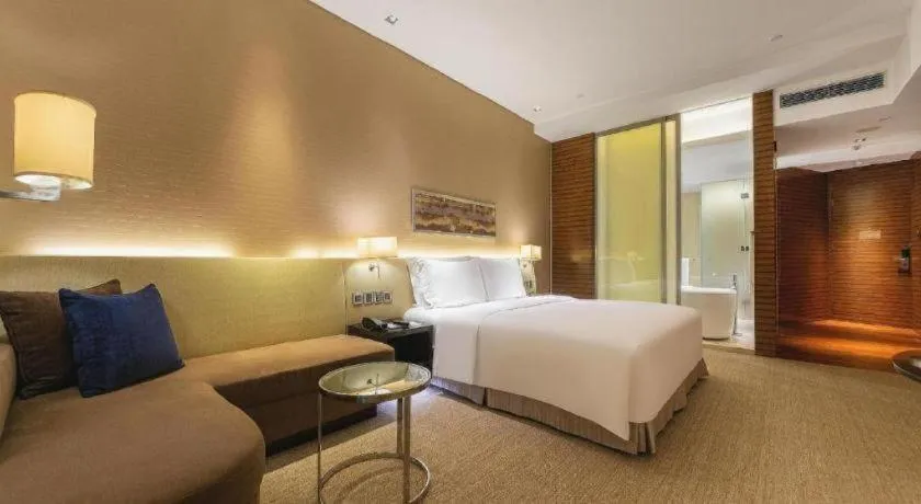 Bed in New World Guiyang Hotel
