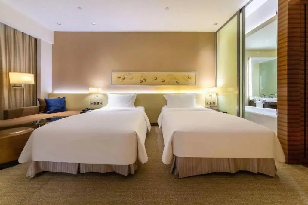 Bed in New World Guiyang Hotel