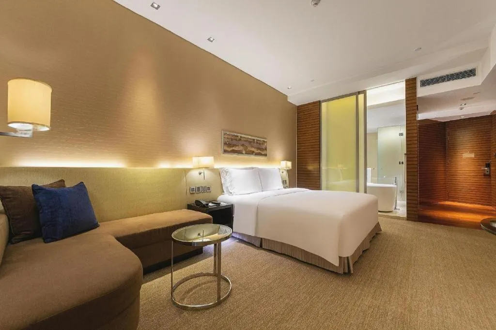 Bed in New World Guiyang Hotel