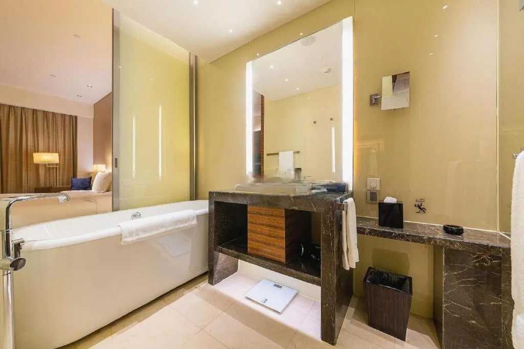 Bed in New World Guiyang Hotel