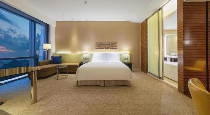 Bed in New World Guiyang Hotel