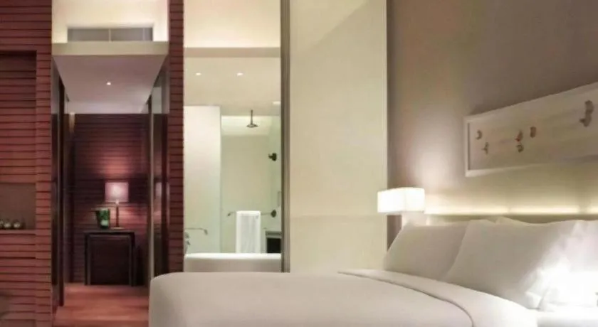 Bed in New World Guiyang Hotel