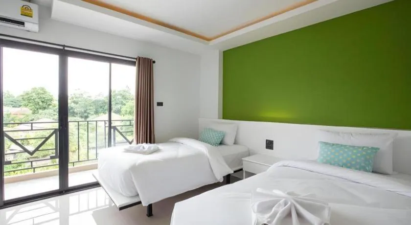 Bed in M Boutique Resort